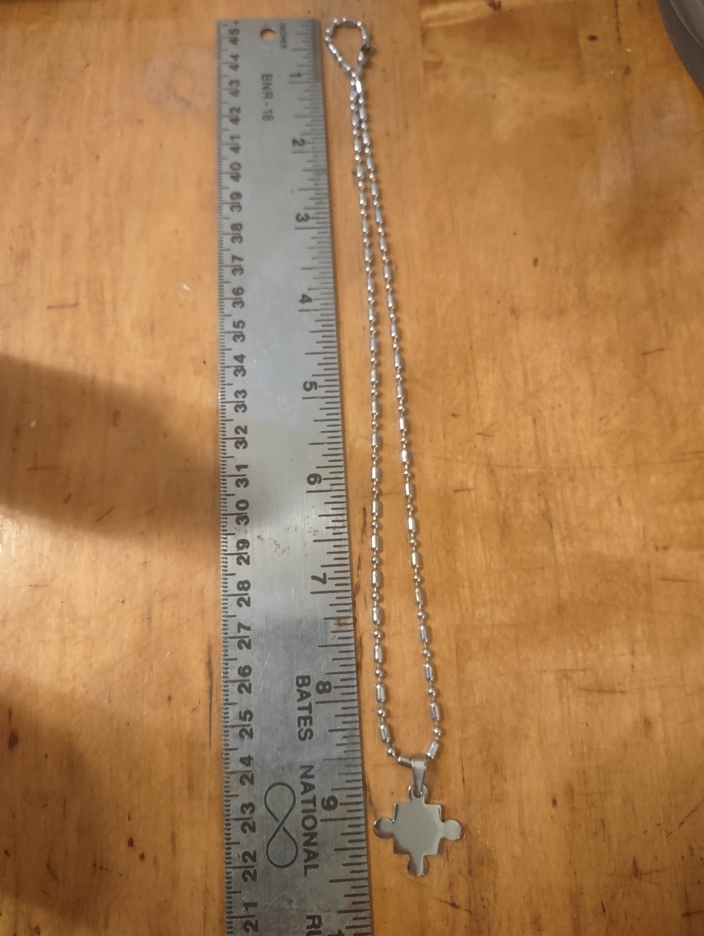 Silver Toned Puzzle Piece Pendant Necklace - Picture 7 of 7